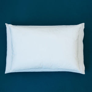 MiteGuard lodge pillow covers provides protection from dust mite allergens. Image shows size difference of lodge pillow compared to a standard sized pillow.